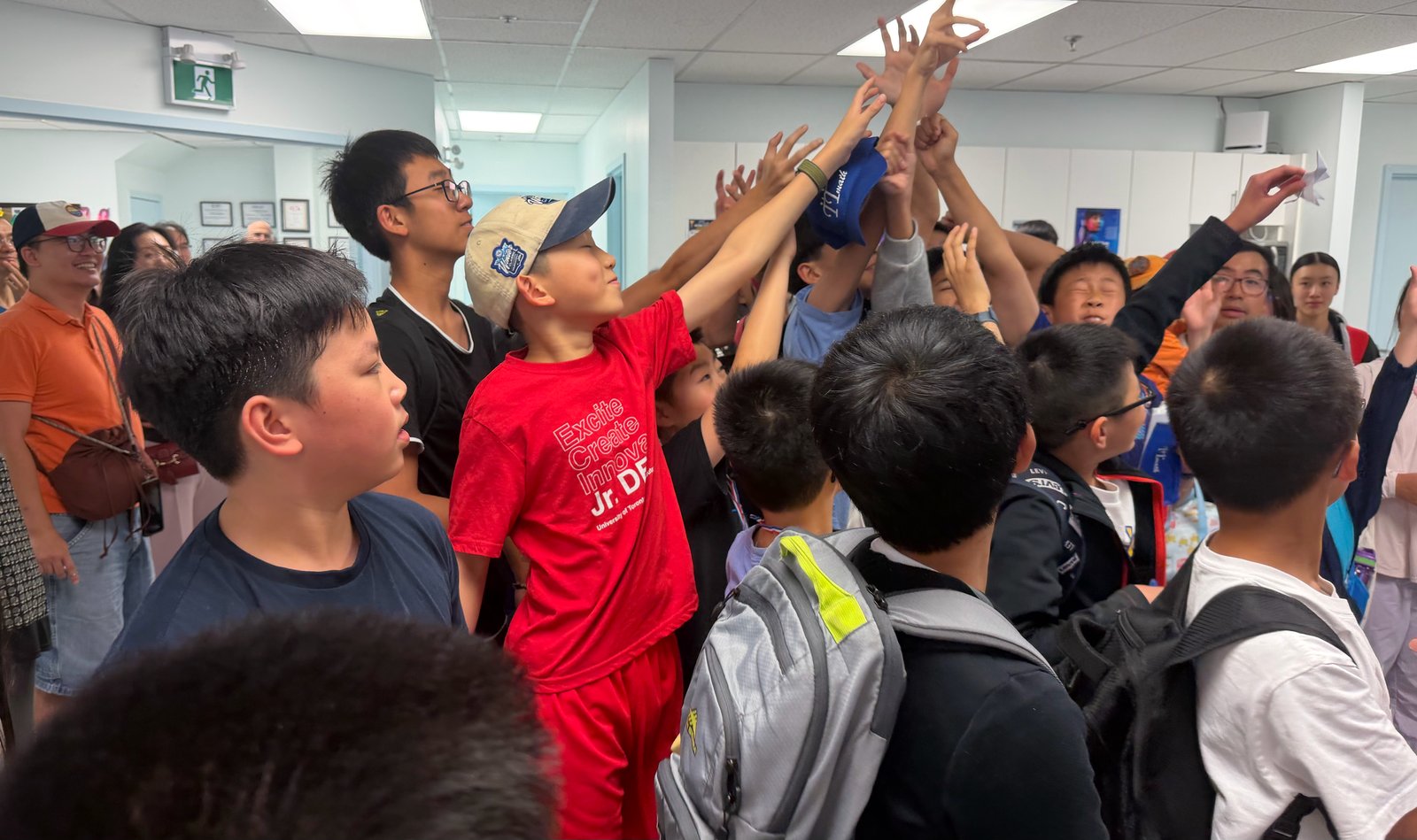 Students reaching for prizes at the 2026 Charity Math Competition